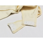 Close-up of beige big u neck shapewear bodysuit snap closures by The Lady's Haven Boutique
