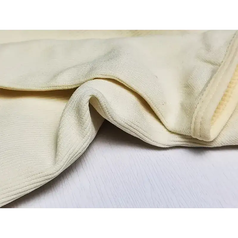 Close-up of beige fabric texture of big u neck shapewear bodysuit from The Lady's Haven Boutique