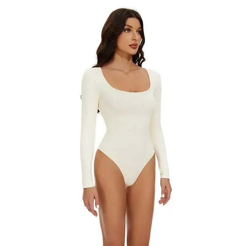 White long sleeve big u neck shapewear bodysuit on model by The Lady's Haven Boutique