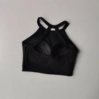 Black gym top fitness camisole with crisscross straps for comfortable workouts