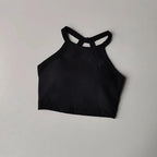 Black gym top fitness camisole with a stylish crisscross design for comfortable workouts
