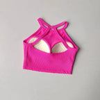 Stylish pink gym top fitness camisole with unique racerback design for active wear