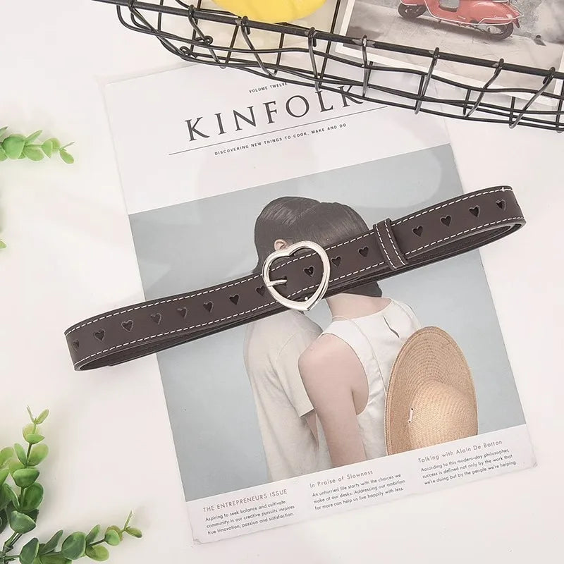 Heart buckle waist belt in brown with heart cutouts for stylish outfits from The Lady's Haven Boutique