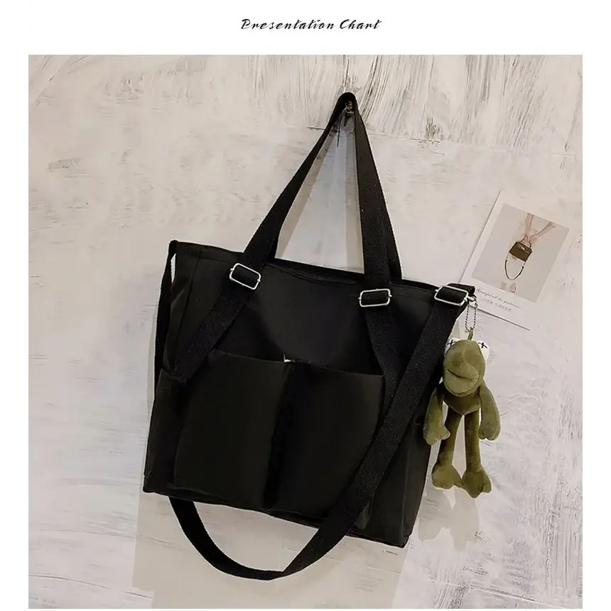 Stylish high capacity waterproof nylon handbags with multiple pockets and a cute keychain charm