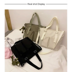High capacity waterproof nylon handbags in three colors: black, beige, and green for stylish everyday use