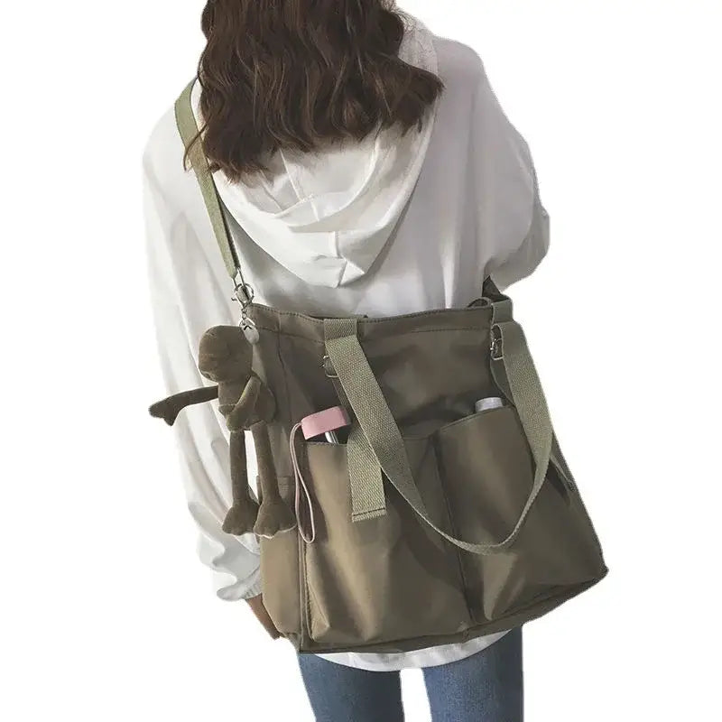 High capacity waterproof nylon handbags in olive green with multiple pockets for easy organization