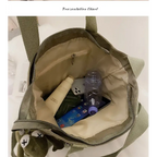 Inside view of high capacity waterproof nylon handbags showing organized space for essentials and a stylish design