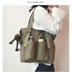 Fashionable high capacity waterproof nylon handbags featuring multiple pockets and adjustable straps