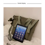 High capacity waterproof nylon handbags in olive green with adjustable straps and pockets