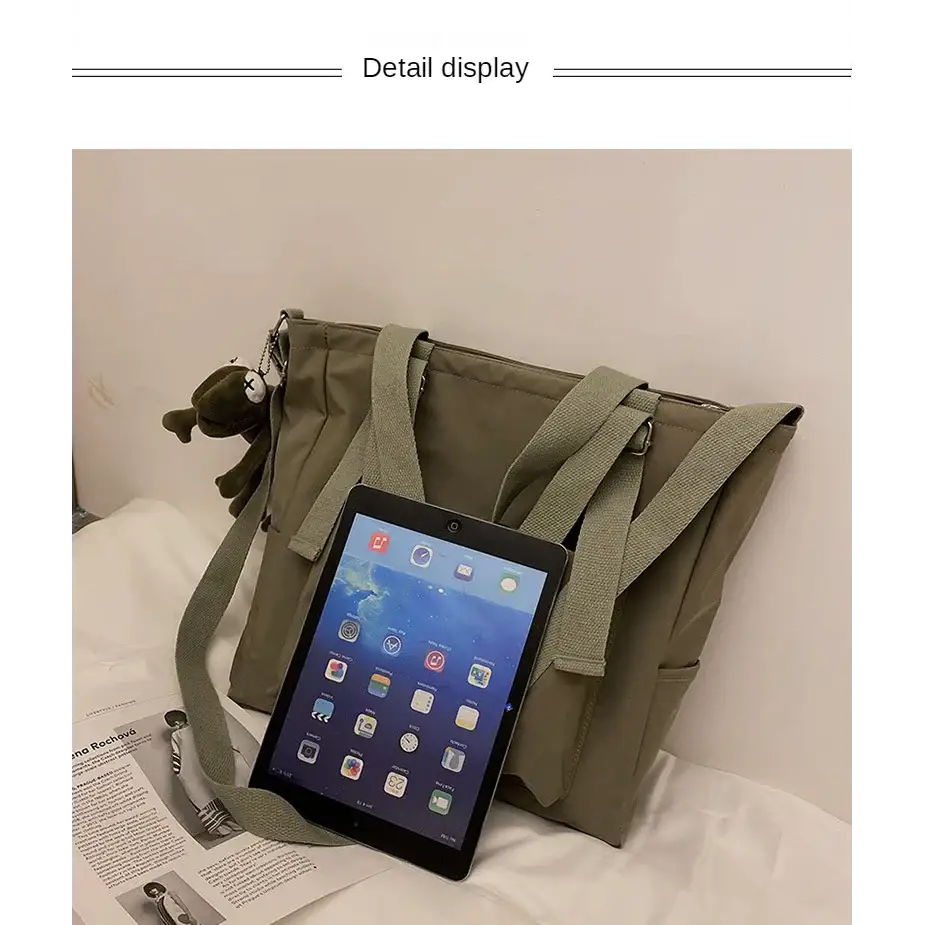 High capacity waterproof nylon handbags in olive green with adjustable straps and pockets