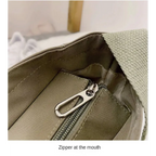 Interior view of a high capacity waterproof nylon handbag featuring a zippered pocket
