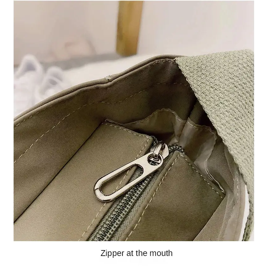 Interior view of a high capacity waterproof nylon handbag featuring a zippered pocket