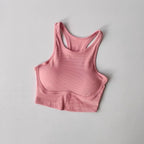 Pink ribbed high impact sports bra for women designed for maximum support during workouts