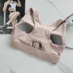 High impact sports bra for women in soft pink with mesh details and racerback design