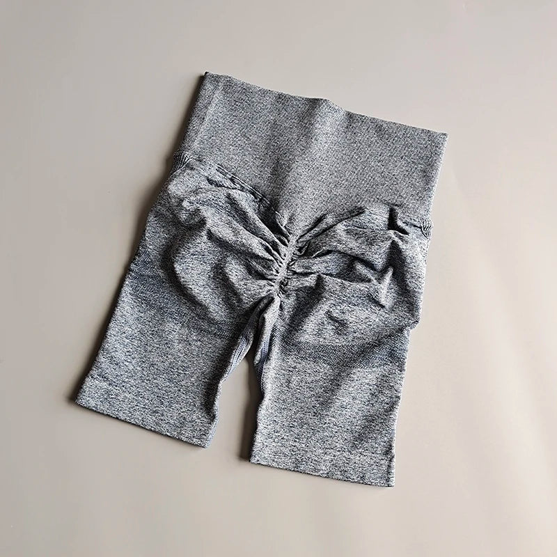 High waist seamless yoga shorts in gray color with gathered detail for added style and comfort