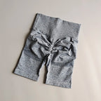 High waist seamless yoga shorts in gray color with gathered detail for added style and comfort