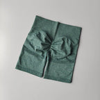 High waist seamless yoga shorts in green fabric with a comfortable design for active wear
