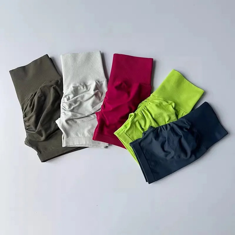 High-waist yoga shorts women in various colors including pink, green, and navy blue