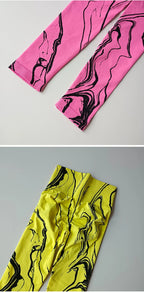 High waisted printed leggings in pink and yellow marble patterns for stylish comfort