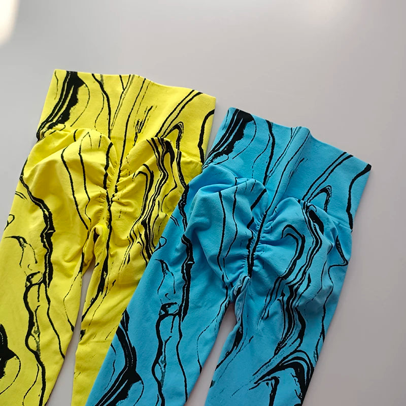 High waisted printed leggings in yellow and blue with unique marble patterns for stylish comfort