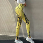 High waisted printed leggings in yellow with abstract black design, ideal for stylish workouts