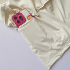 Beige high-waisted sports shorts women with side pocket for phone and essentials