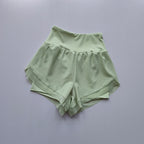 Light green high-waisted sports shorts women with a layered design for comfort during workouts