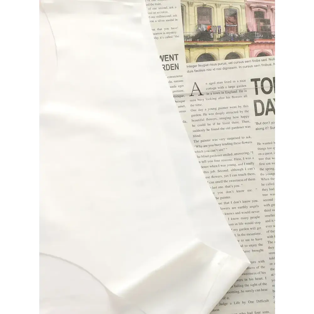 White hip lifting seamless panties for women displayed on newspaper background