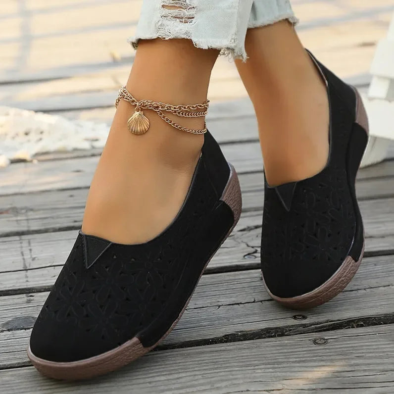 Black hollow out casual shoes for ladies with comfortable brown sole and stylish cutout design