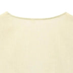 Close-up of the neckline detail on a cream-colored short sleeve blouse and pant set from The Lady's Haven Boutique