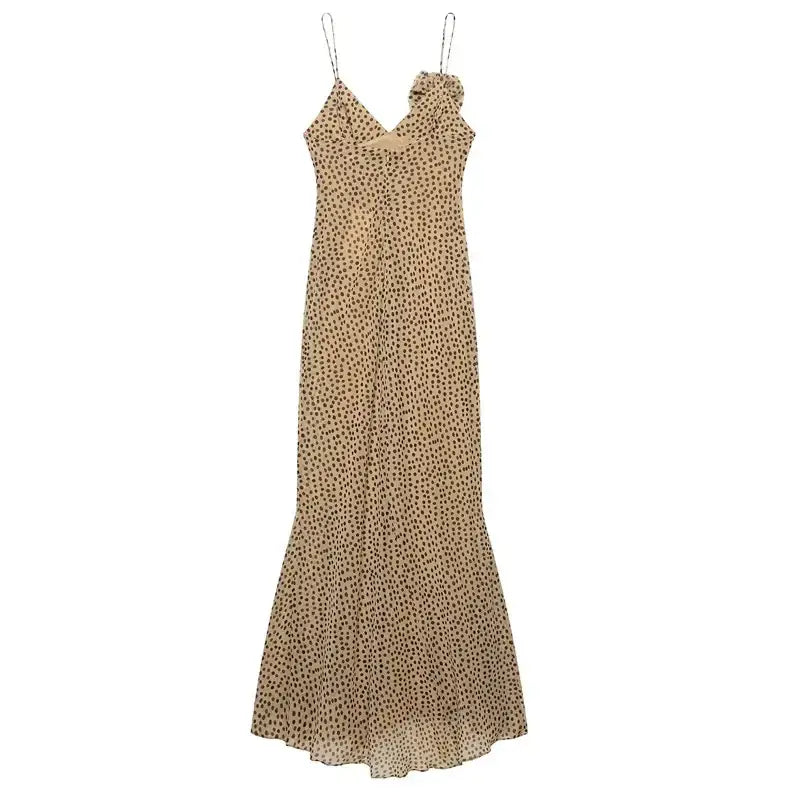 Elegant polka dot maxi dress with spaghetti straps and flowing skirt in beige and black