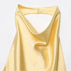 Soft yellow satin halter crop tops with a draped neckline and back button closure