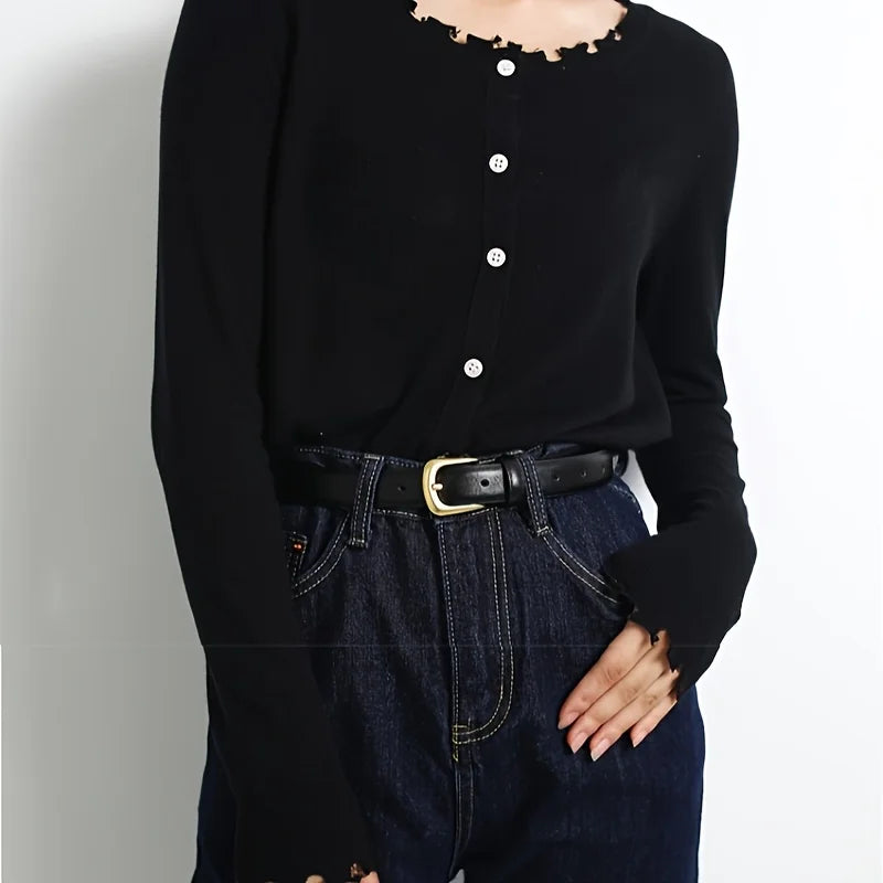 Stylish black jeans belt for women paired with a chic black button-up top