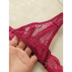 The Lady's Haven Boutique lace low waisted thongs in red floral lace fabric held in hand