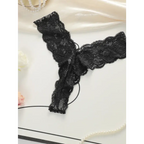 Black lace thong underwear for women featuring delicate floral lace design and scalloped edges