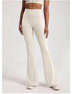 Stylish ladies bell-bottom yoga pants in white, designed for comfort and flexibility during workouts