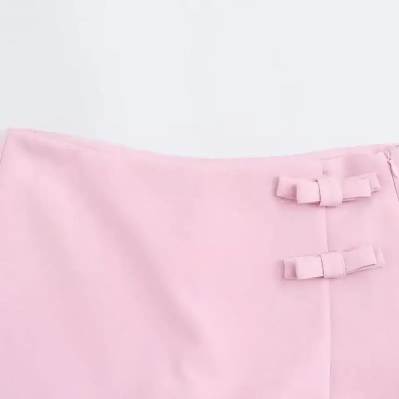 Pink casual mid waist short skirt with decorative bow details from The Lady's Haven Boutique