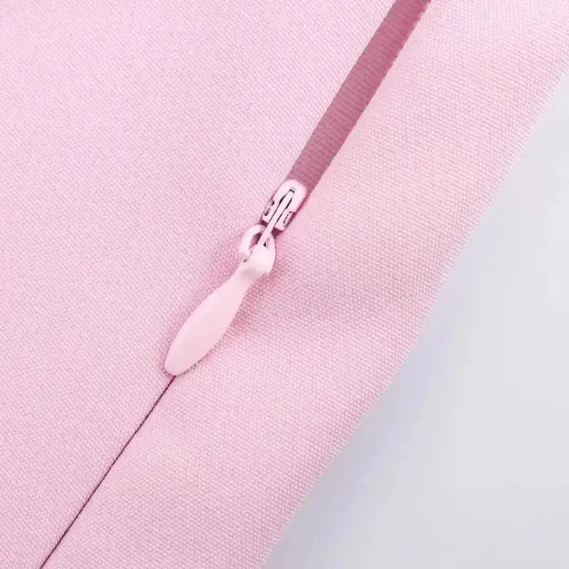 Close-up of pink fabric zipper detail on casual mid waist short skirt