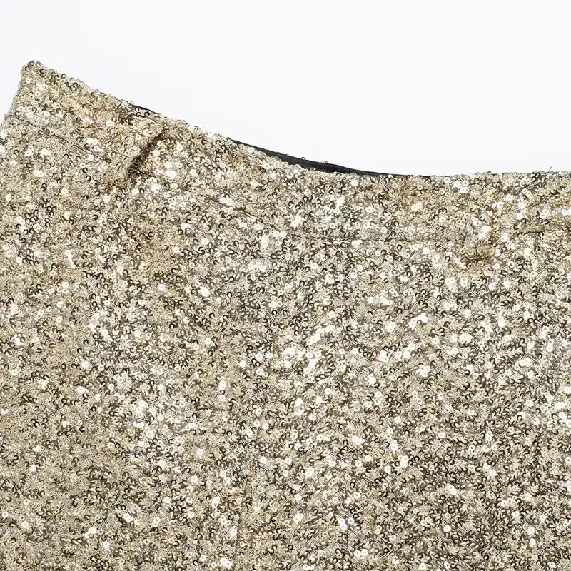 Close-up of elegant mid waist sequin shorts in gold from The Lady's Haven Boutique