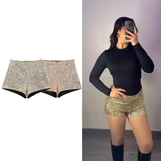 Elegant mid waist sequin shorts in gold and silver sparkle displayed and worn with black top