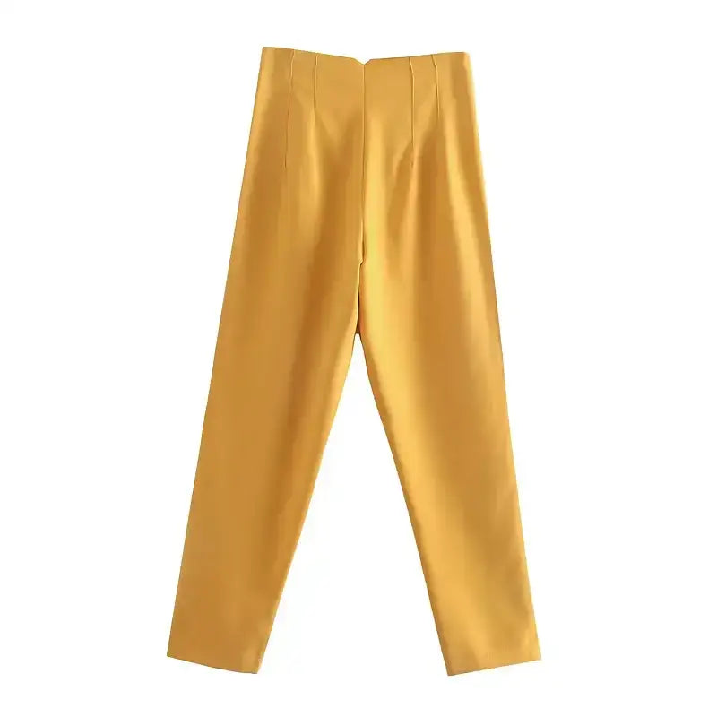 Yellow elegant slim fit pencil trousers laid flat showcasing sleek design and tailored fit