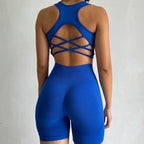 Back view of a blue ladies fitness clothing set with crisscross design and high-waisted shorts