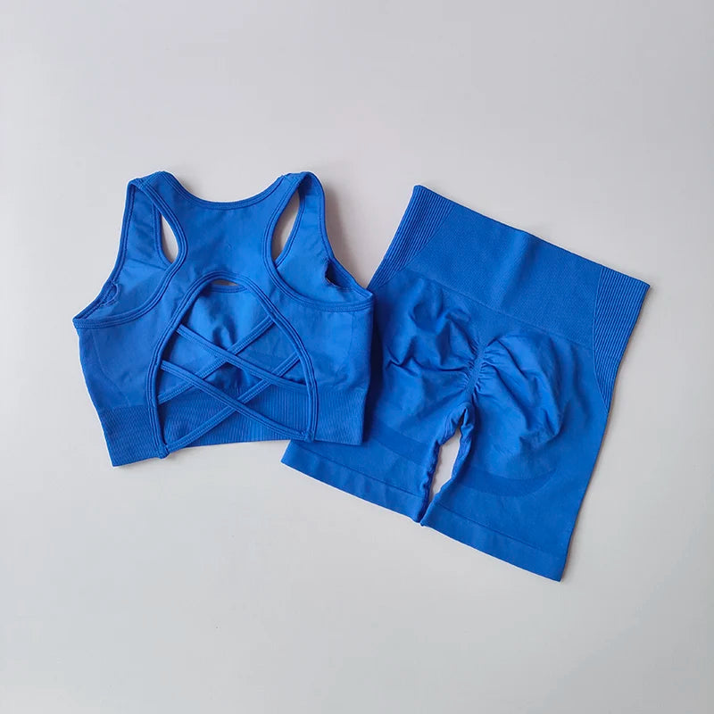 Ladies fitness clothing set in vibrant blue featuring a stylish sports bra and high-waisted shorts