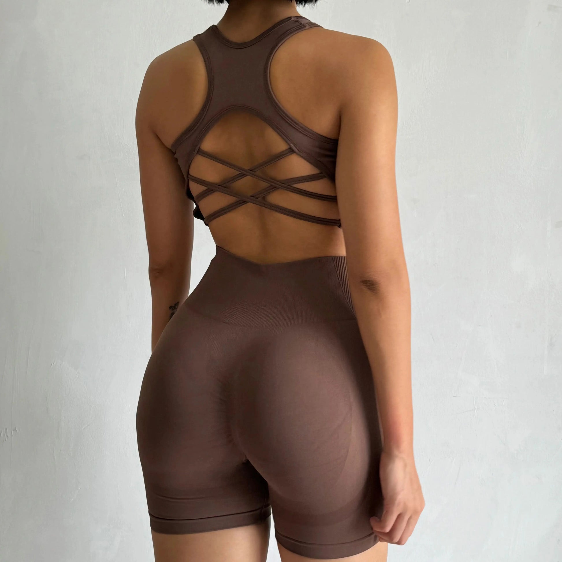 Stylish ladies fitness clothing set in brown with a crisscross back design for optimal comfort and support