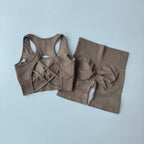 Ladies fitness clothing set featuring a stylish back design sports bra and high-waisted shorts