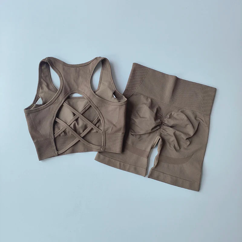 Ladies fitness clothing set featuring a stylish back design sports bra and high-waisted shorts