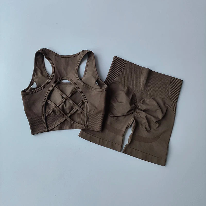 Ladies fitness clothing set featuring a stylish crisscross sports bra and high-waisted shorts