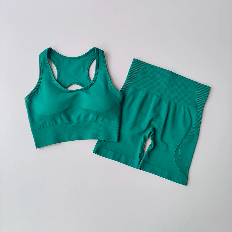 Teal ladies fitness clothing set featuring a crop top and matching shorts for active workouts