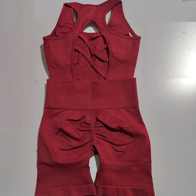 Burgundy ladies fitness clothing set featuring a stylish cutout tank top and high-waisted leggings