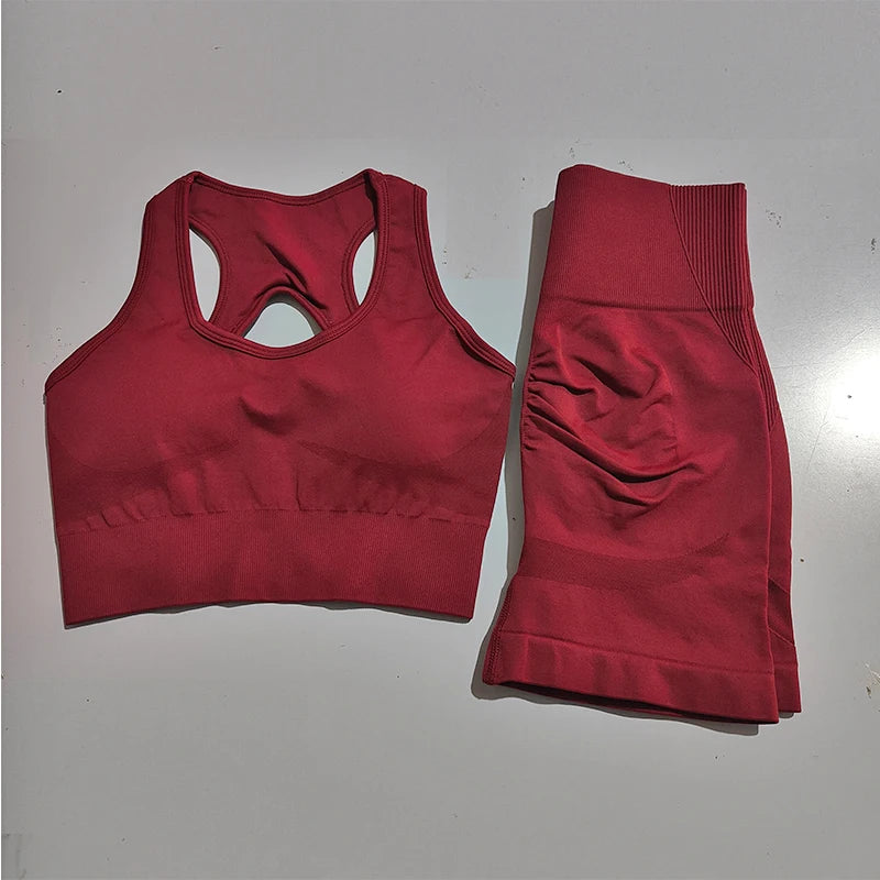Stylish ladies fitness clothing set in burgundy, including a supportive sports bra and high-waisted leggings